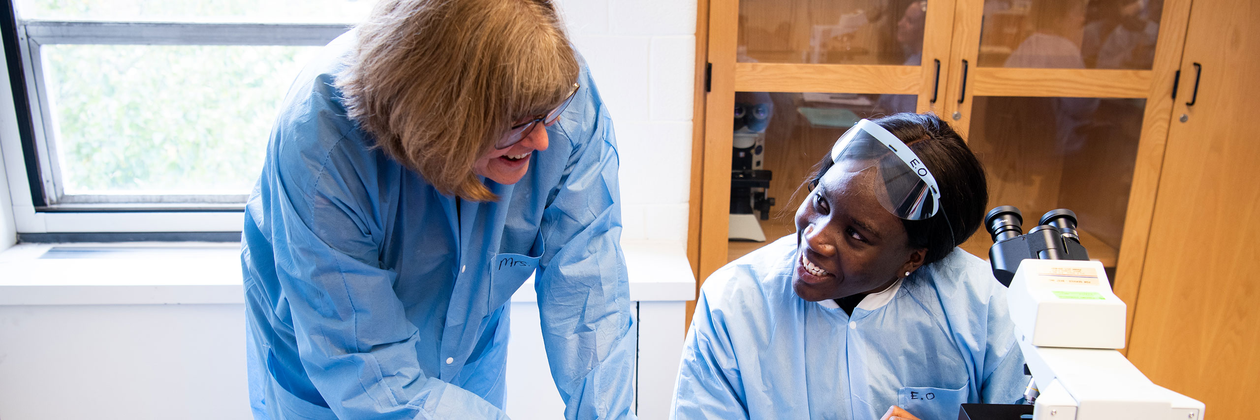 Professor and Student working on a lab