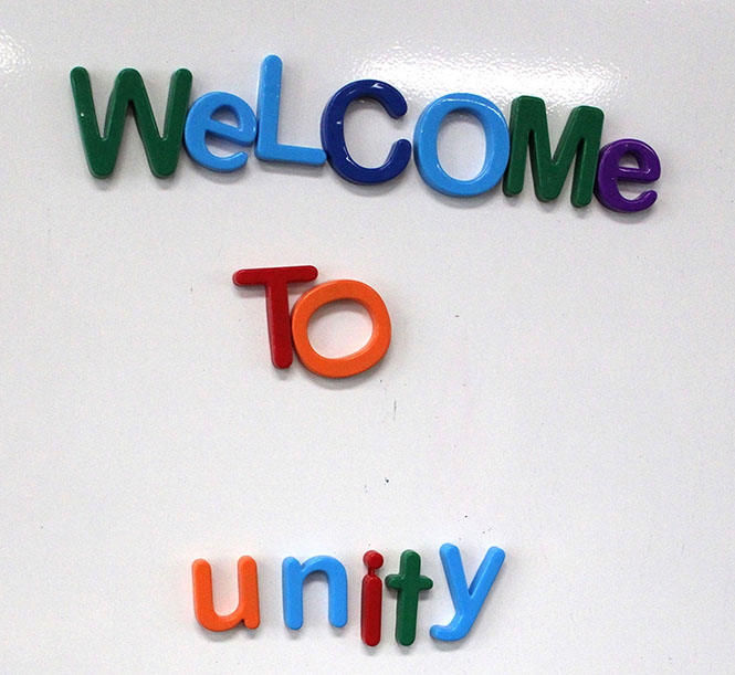Unity Community Center profile picture with "Welcome to Unity" written in colorful magnetic letters on a whiteboard.